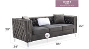 Glory Furniture Paige stationary sofa with plush cushions and modern design, shown in a cozy living room setting.