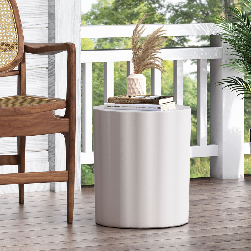 Antique white outdoor end table with soft wave edge, Noble House stylish accent piece for patio or garden decor.