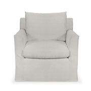 Classic Home Cassiano swivel chair with padded upholstery and wooden base, shown in a cozy living room setting.