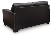 Midnight-colored Glennbre stationary loveseat by Signature Design Ashley, featuring plush cushions and sleek fabric upholstery.