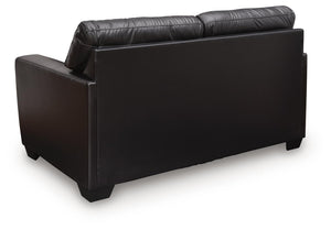 Midnight-colored Glennbre stationary loveseat by Signature Design Ashley, featuring plush cushions and sleek fabric upholstery.