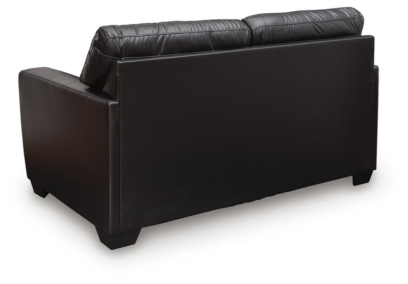Midnight-colored Glennbre stationary loveseat by Signature Design Ashley, featuring plush cushions and sleek fabric upholstery.