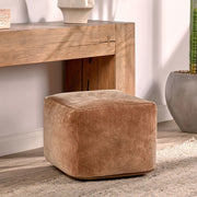 Velvet Hazel accent pouf by Classic Home featuring plush fabric and a round, stylish design for cozy living spaces.