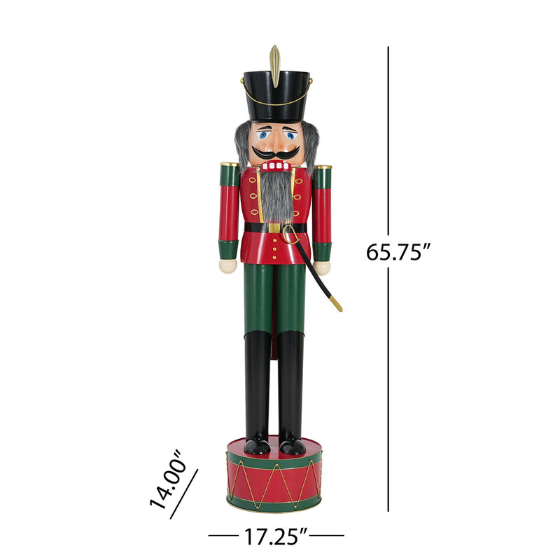 Noble House classic nutcracker holiday decor in green and red, showcasing a festive Christmas figure with intricate details.