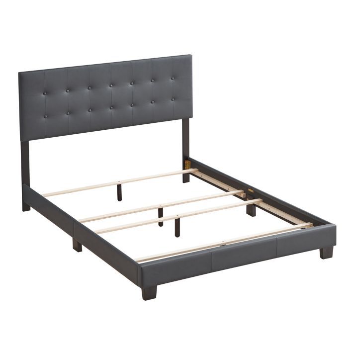 Upholstered Caldwell bed by Glory Furniture with a plush, padded headboard and neutral fabric, shown in a cozy bedroom setting.