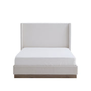 House & Home Furniture Hale upholstered wingback bed with padded headboard and fabric upholstery in a cozy bedroom setting.