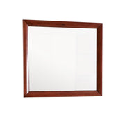 Glory Furniture Marilla mirror with sleek, modern frame, hanging on a wall in a contemporary interior setting.