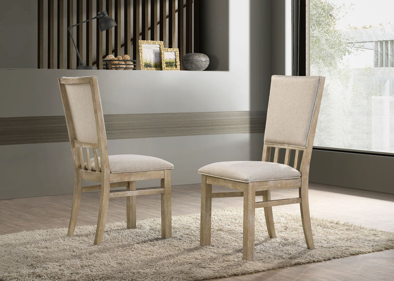 Set of two Lilola Home Brutus wide dining chairs with reclaimed wheat finish, featuring sturdy wooden frames and modern design.