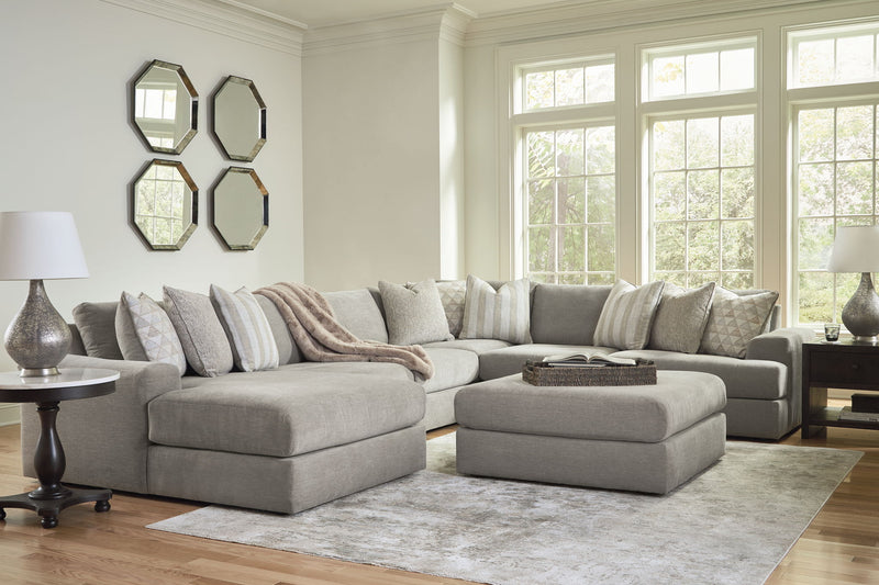 Signature Design by Ashley Avaliyah 5-piece living room set with sofa, loveseat, and chairs arranged in a modern living space.