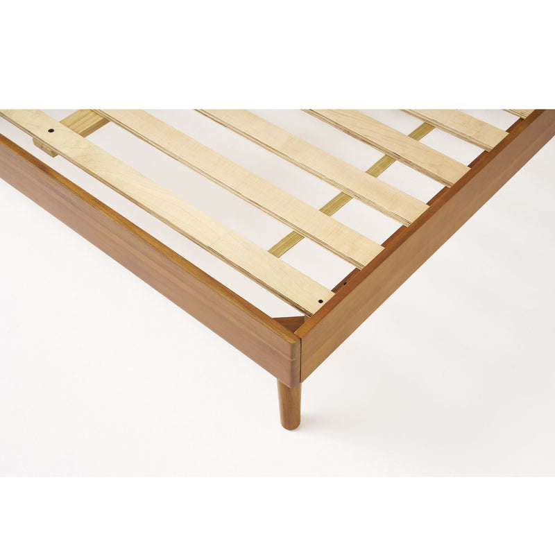 Natural stained solid acacia wood platform bed with mid-century design by Noble House, showcasing the sleek, sturdy frame and clean lines.