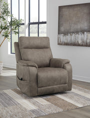 Signature Design by Ashley Crestmeade Power Lift Recliner in neutral upholstery with padded arms and plush cushioning.