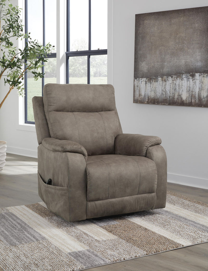 Signature Design by Ashley Crestmeade Power Lift Recliner in neutral upholstery with padded arms and plush cushioning.