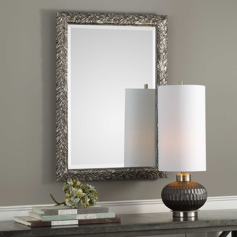 Uttermost Evelina Leaves Silver Wall Mirror with intricate leaf design and oval shape, decorative silver finish.
