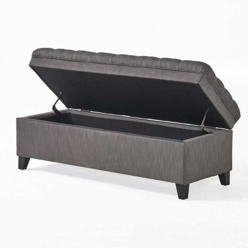 Juliana storage ottoman by Noble House with birch wood legs, upholstered in neutral fabric, showing a soft, plush seating surface.