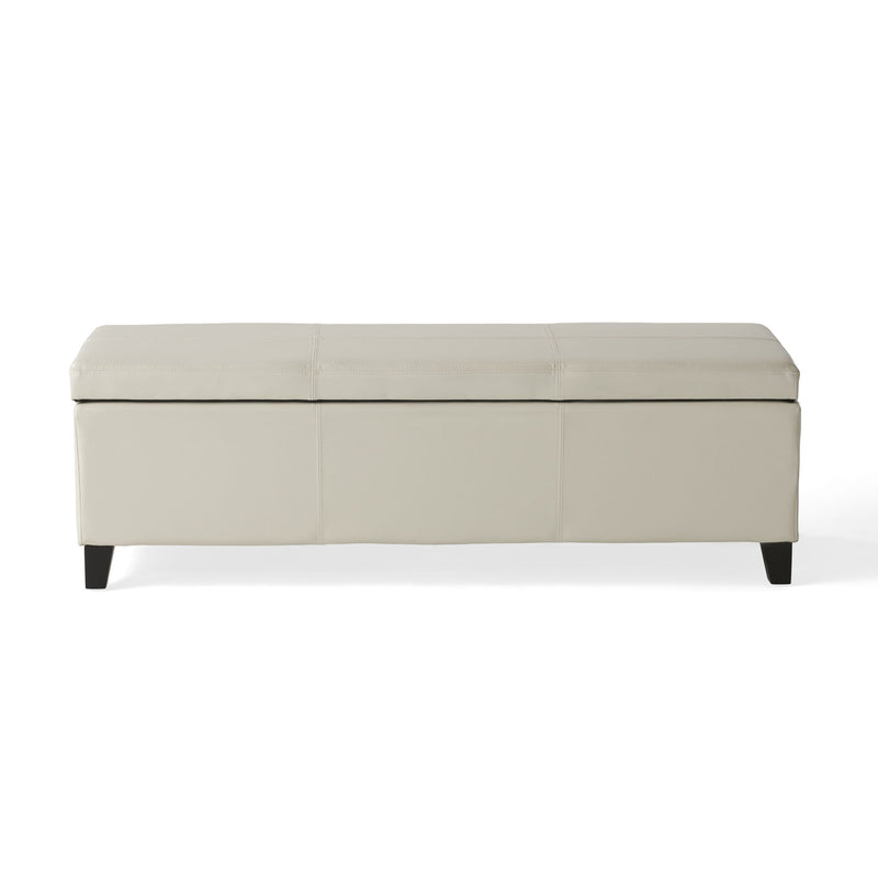 Noble House Glouster contemporary storage ottoman with fabric upholstery and hidden storage compartment, in a modern living room setting.