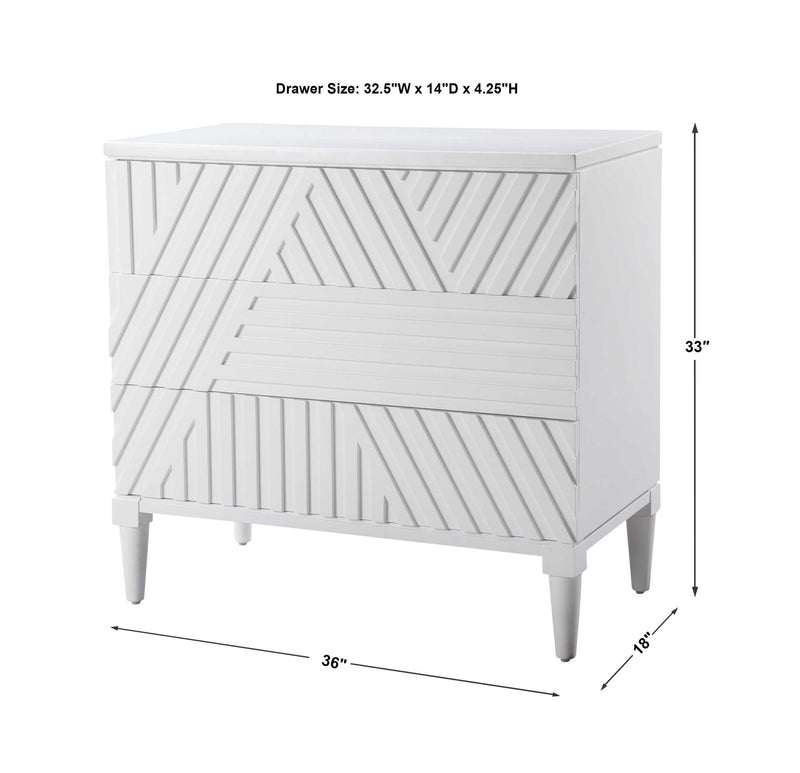 Uttermost Colby Drawer Chest in a natural wood finish with sleek metal handles, designed as an elegant accent chest.