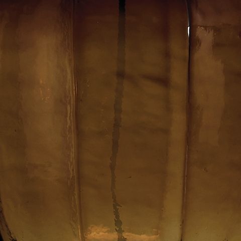 Bainmore - Glass Table Lamp - Amber - R&R Furniture Gallery (Fountain Valley, CA)