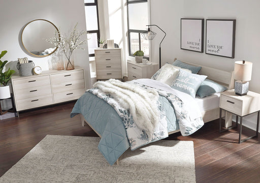 Signature Design by Ashley Socalle 3-piece bedroom set with a bed, nightstand, and dresser in a modern bedroom scene.
