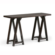 Handcrafted Simpli-Home console sofa table with a sawhorse-style design, featuring a sleek wooden surface and sturdy legs.