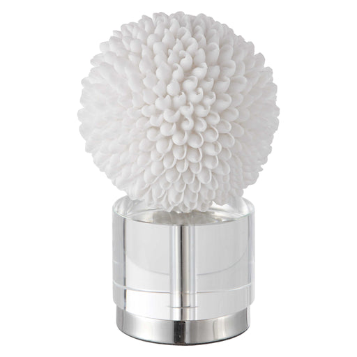 White Cascara sculpture by Uttermost, featuring an elegant abstract figurine with smooth curves on a textured base.