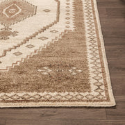 Classic Home Luxor hand-knotted area rug with intricate patterns and rich colors, showcasing detailed craftsmanship.