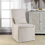 Uttermost Coley armless side chair with plush upholstered seat and wooden legs, modern and stylish furniture for living spaces.