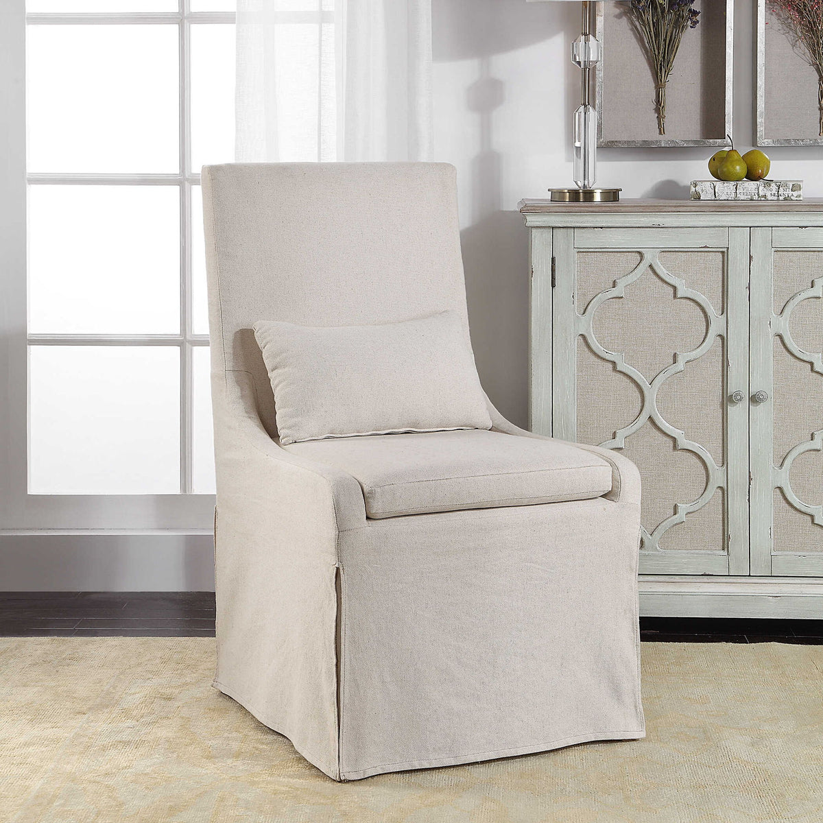 Uttermost Coley armless side chair with plush upholstered seat and wooden legs, modern and stylish furniture for living spaces.