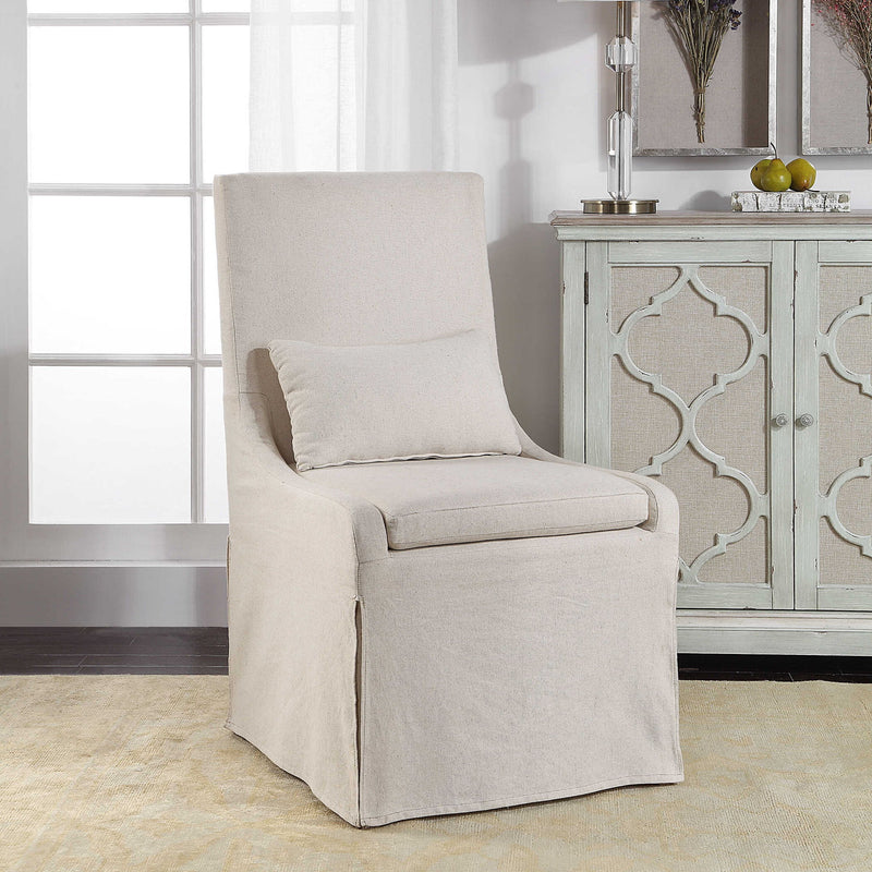 Uttermost Coley armless side chair with plush upholstered seat and wooden legs, modern and stylish furniture for living spaces.
