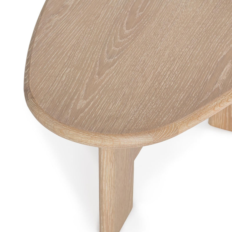 Classic Home Langford coffee table with a wooden finish and sleek design, shown from a side angle in a modern living room setting.