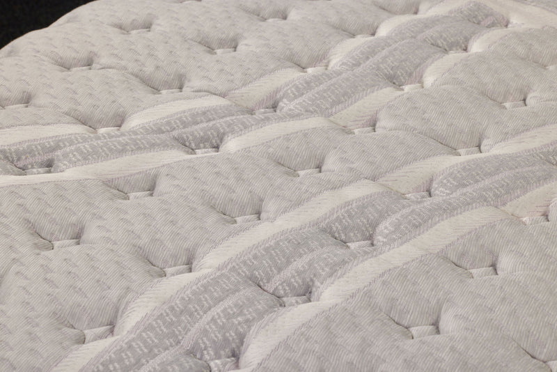 Restonic ComfortCare Hybrid CosmoRest Euro Top mattress with plush fabric cover and supportive design for comfortable sleep.