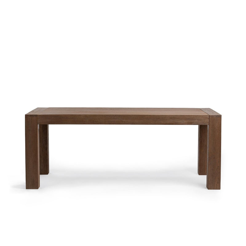Classic Home Glendale dining table in toasted chestnut wood, showing a spacious rectangular surface with sturdy legs.