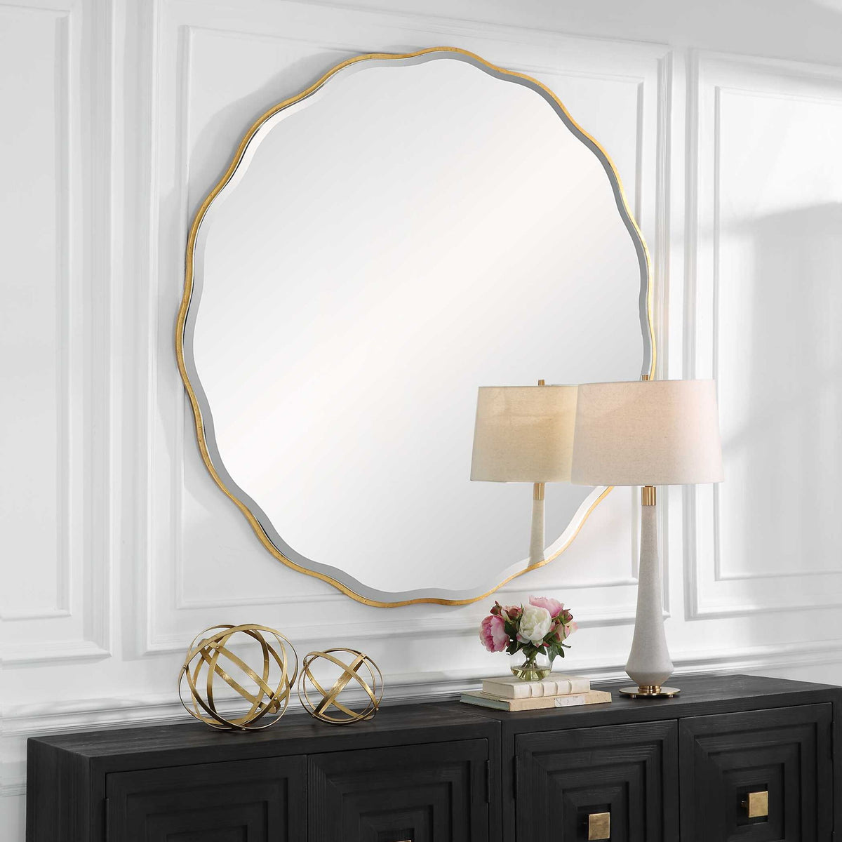 Uttermost Aneta round wall mirror with a sleek frame, designed for modern wall decor.