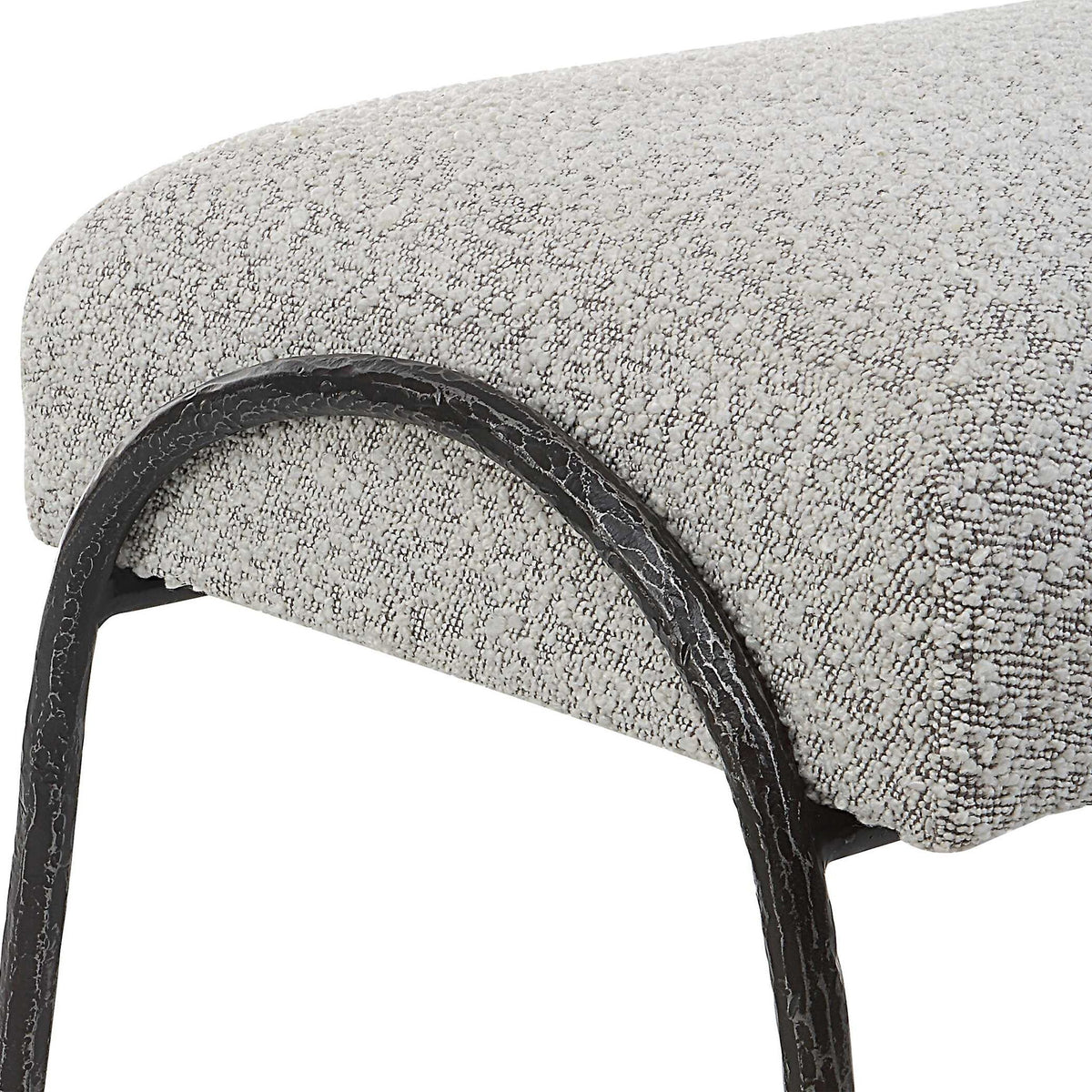 Gray upholstered Jacobsen modern bench by Uttermost with sleek, contemporary design and cushioned seating.