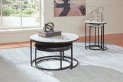 Set of four black and white nesting tables by Signature Design by Ashley, featuring sleek, modern design and versatile surface space.