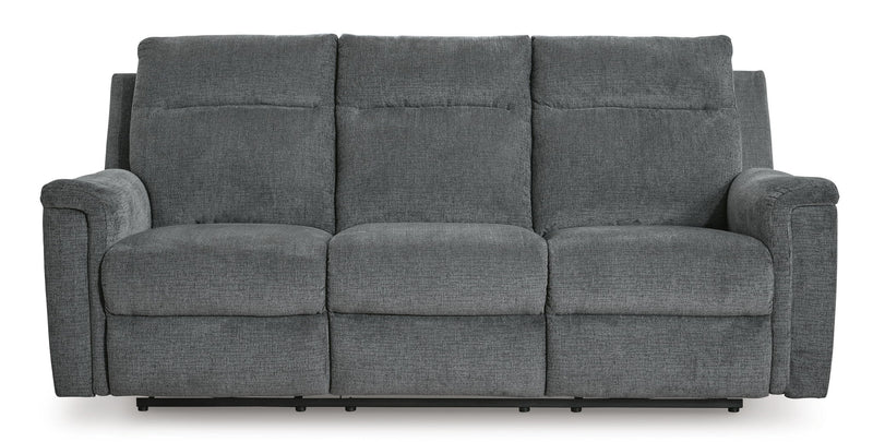 Signature Design by Ashley Barnsana Power Reclining Sofa with plush cushions and reclining features in a modern living room setting.