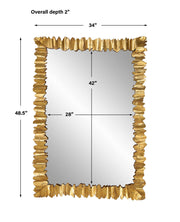 Gold accent mirror by Uttermost featuring a sleek, modern design with a round shape and a reflective glass surface.