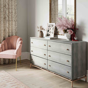 TOV Furniture Pesce 6-drawer dresser with sleek wood finish and modern design, featuring six spacious drawers for storage.