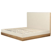 ACME Zoey upholstered bed with plush fabric and a modern design, shown in a stylish bedroom setting.