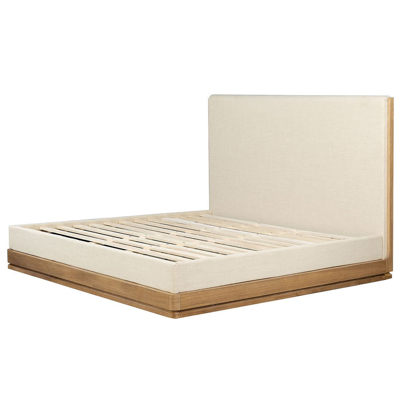 ACME Zoey upholstered bed with plush fabric and a modern design, shown in a stylish bedroom setting.