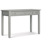 Handcrafted Warm Shaker writing desk by Simpli-Home with a natural wood finish and clean design, featuring a spacious surface and storage drawers.