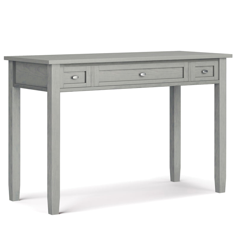 Handcrafted Warm Shaker writing desk by Simpli-Home with a natural wood finish and clean design, featuring a spacious surface and storage drawers.