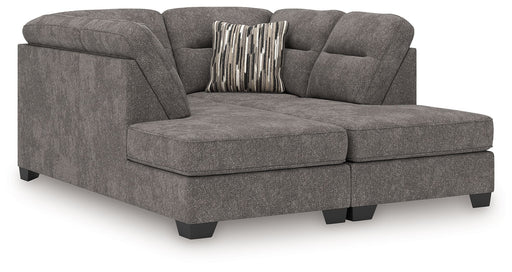 Benchcraft Olten stationary sectional sofa with plush cushions and modern design, shown in a cozy living room setting.