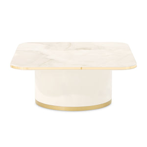 Michael Amini Gineverra rectangular cocktail table with a sleek glass top and elegant wooden frame.