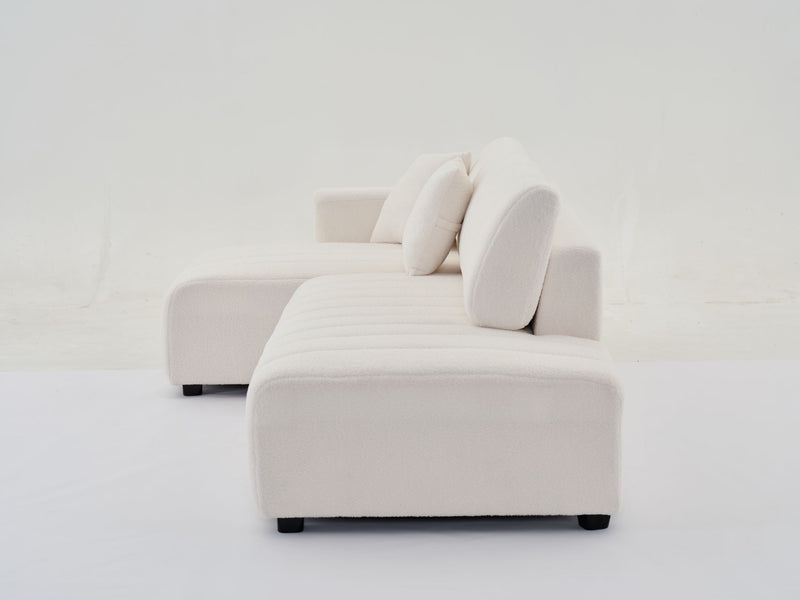 Urban Retreats Jessica lamb wool sectional sofa with chaise, featuring a versatile stationary configuration in a cozy living room setting.