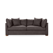 Classic Home Audrey stationary sofa with plush fabric and elegant design, shown in a cozy living room setting.