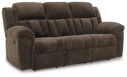 Reclining living room set with plush fabric sofas and loveseats from Signature Design by Ashley, featuring padded armrests and built-in recliners.