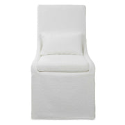 Uttermost Coley armless side chair with plush upholstery and sleek wooden legs, modern design for living or dining spaces.