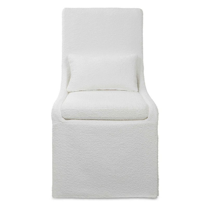 Uttermost Coley armless side chair with plush upholstery and sleek wooden legs, modern design for living or dining spaces.