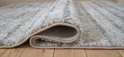 Signature Design by Ashley Laddway area rug with geometric pattern in neutral tones for modern home decor.