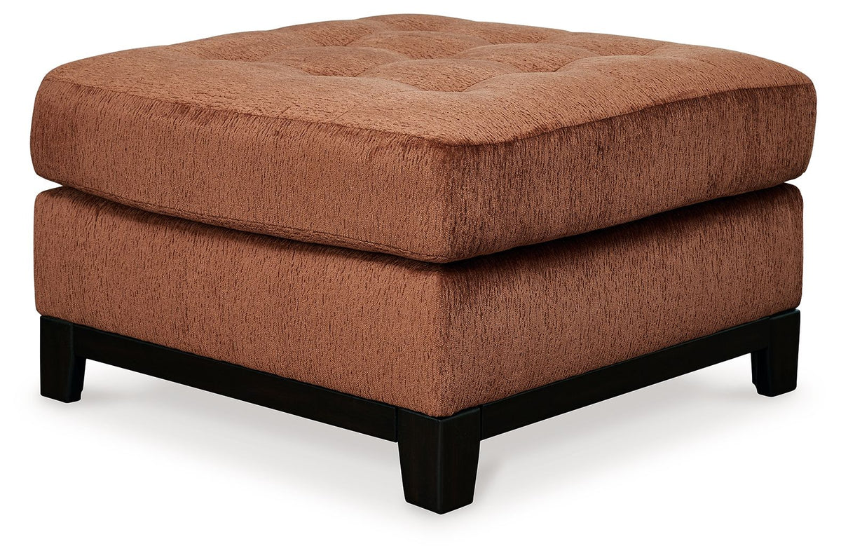 Ashley® Laylabrook oversized plush accent ottoman in spice with dark wood trim, square shape and soft fabric upholstery.
